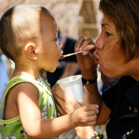 Child receiving a meal