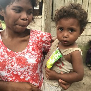 Community members with a child